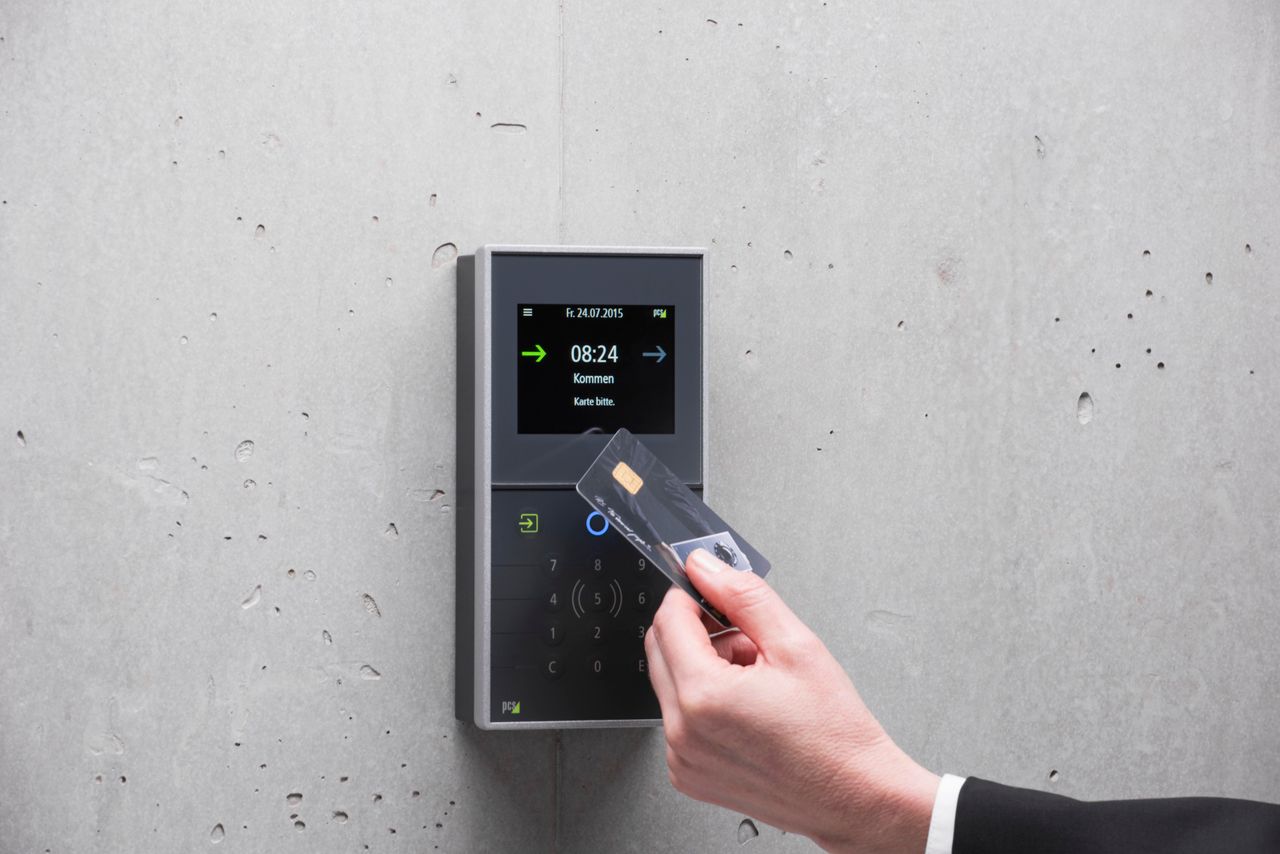 Mastering the First Impression: Your intriguing post title goes here A businessman uses a secure card reader access system against a concrete wall.
